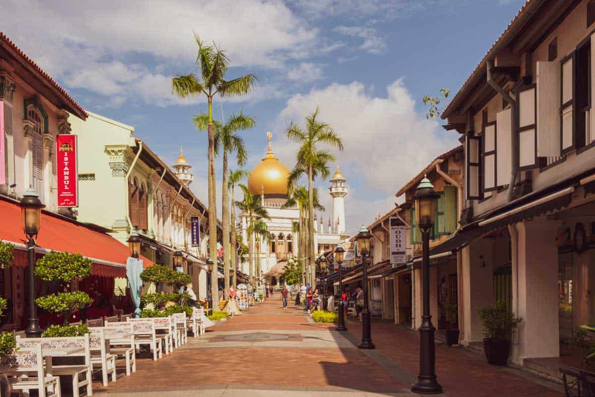 a photo of Bussorah Street with Sultan's Mosque at the end of the street in Kampong Glam on day 4 of Singapore itinerary