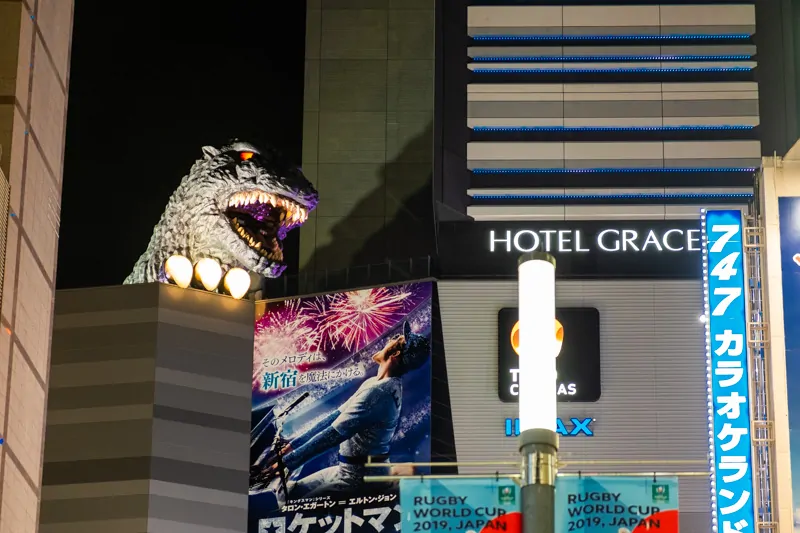 Godzilla head peering over the top of the Hotel Gracery in Tokyo