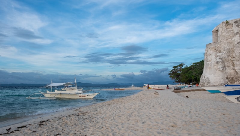 a beach at dusk on Pamilacan Island