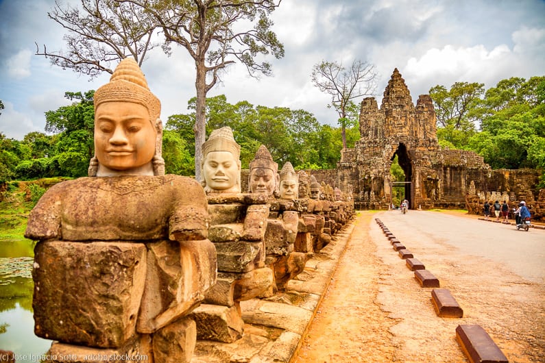 a row of sculptures on Causeway leading to South Gate of Angkor Thom