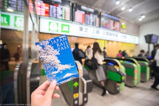 a person holding a Japan Rail Pass