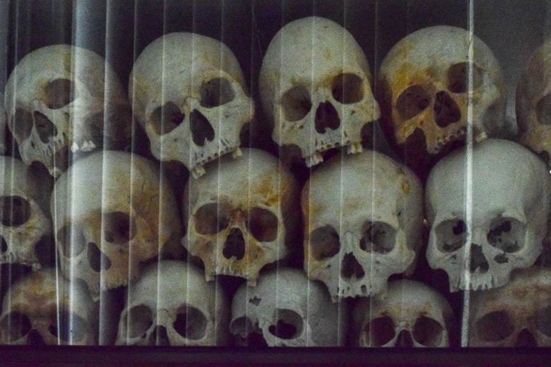 skulls stacked on to of each other at the Killing Fields Genocide Museum in Phnom Penh on Cambodia itinerary