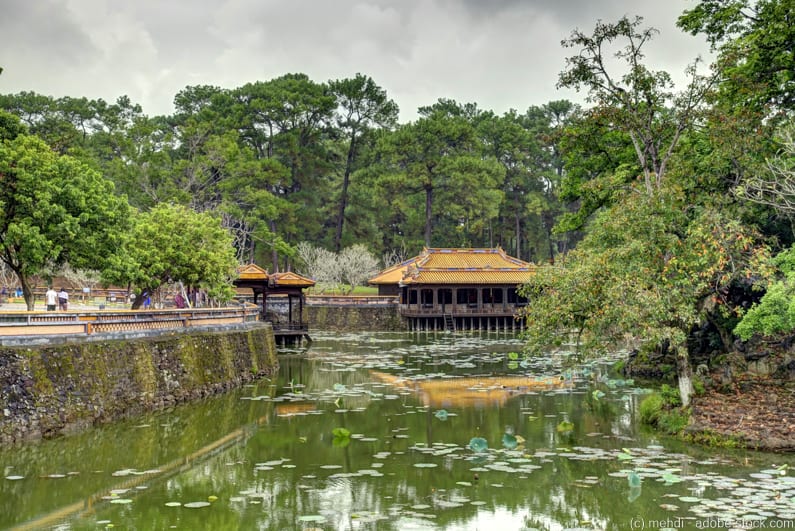 a lake in front of wooden pavilion at the tomb of Tu Duc on Hue itinerary