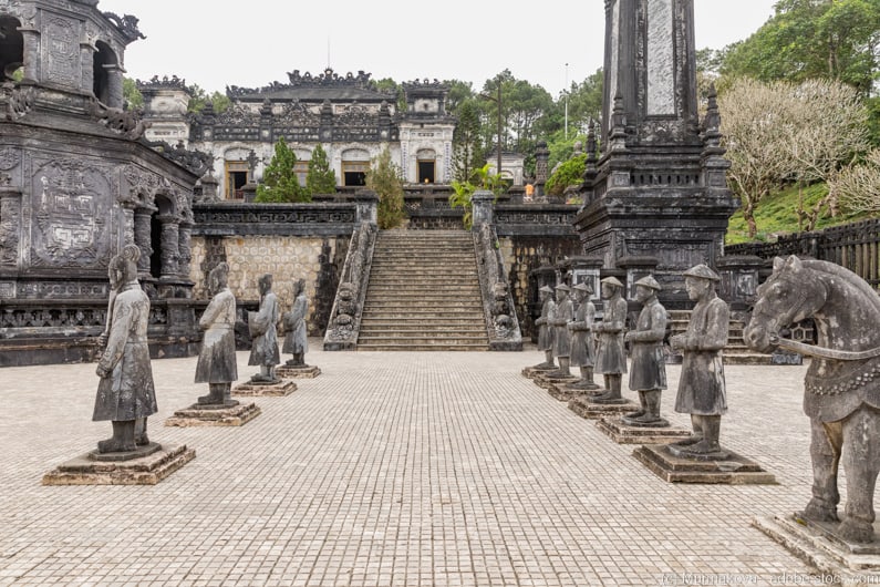 statues lining path to stairs to the Tomb of Khai Dinh on Hue itinerary