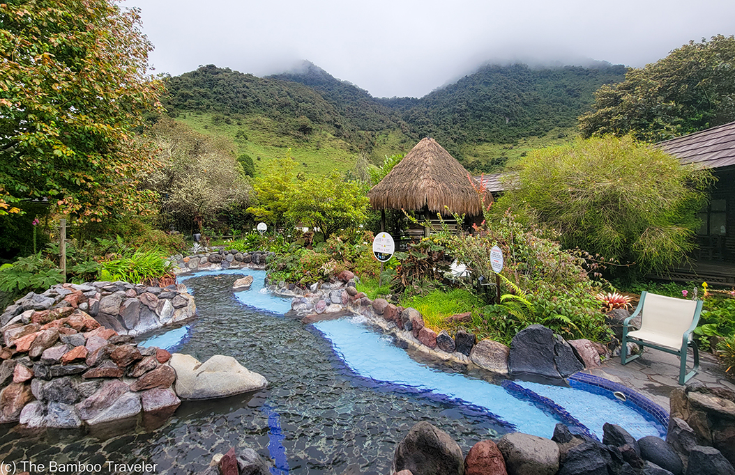 hot spring pools with mountains in the background