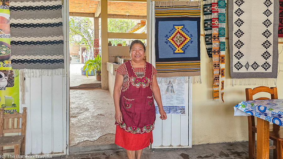 a woman standing in Comedor Jaguar restaurant in Teotilan de Valle