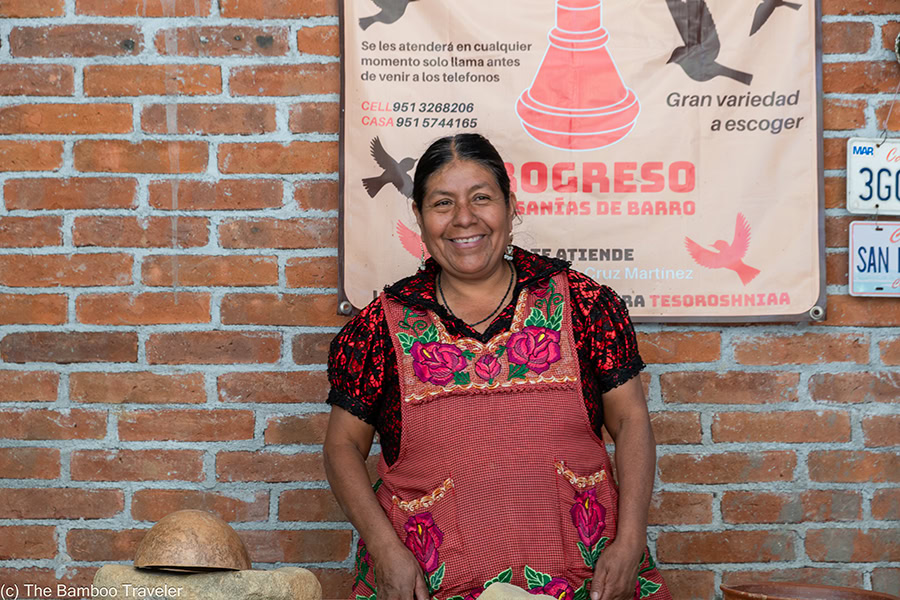 a woman standing and smiling