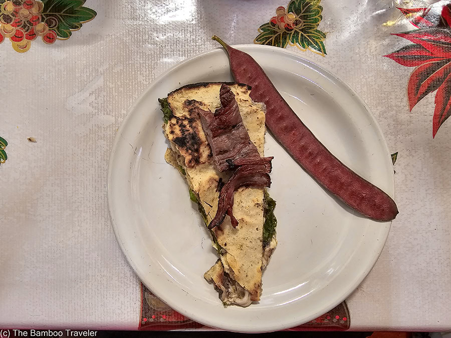 a slice of a tlayuda on a plate