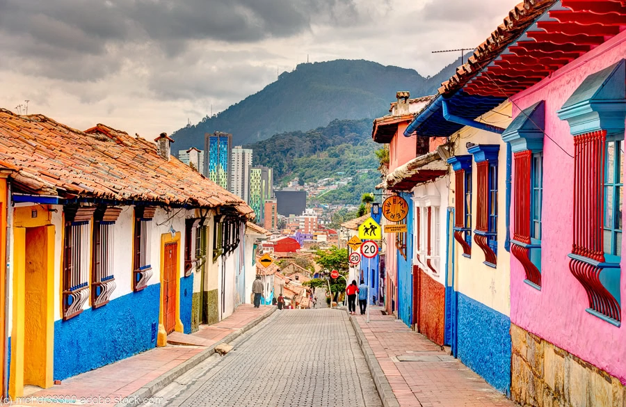 a street lined with colorful buildings in Bogota, one of the best places to visit in Colombia