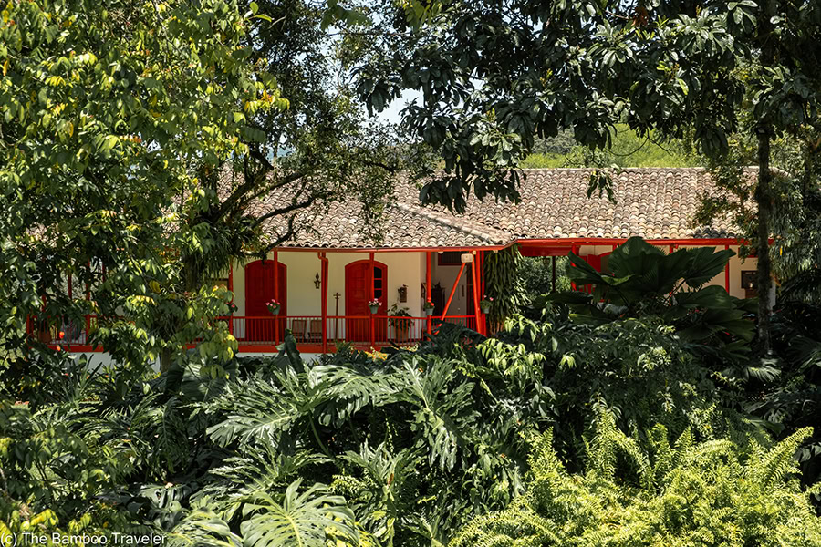 a view of a building with red doors and red trim