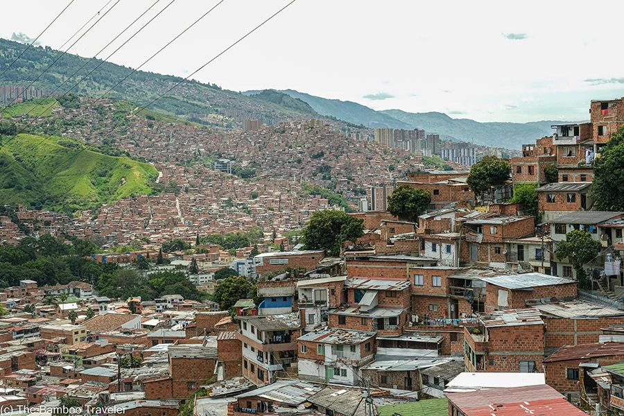 red brick buildings on the slope of a mountain