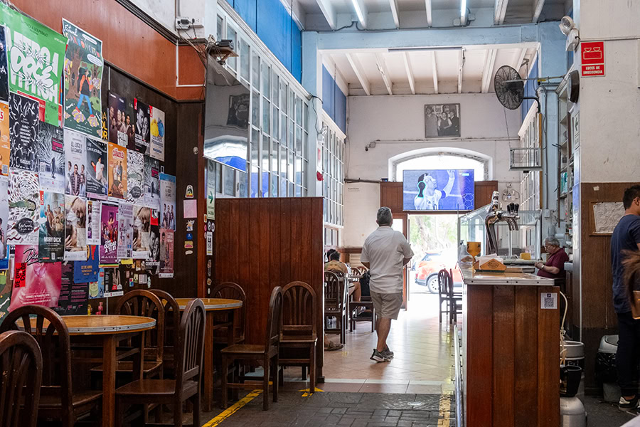 a man walking out of a bar