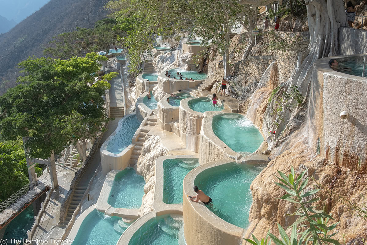 Mexico City Day Trip Tolantongo Hot Springs – 8806 A high-angle view of the cascading turquoise thermal pools and hot springs at Grutas Tolantongo in Hidalgo, Mexico.